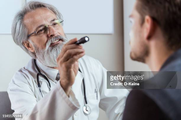 doctor counseling patient - eyesight problem stock pictures, royalty-free photos & images