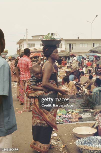 People shopping at a market in Adjamé, Ivory Coast, February 1975.