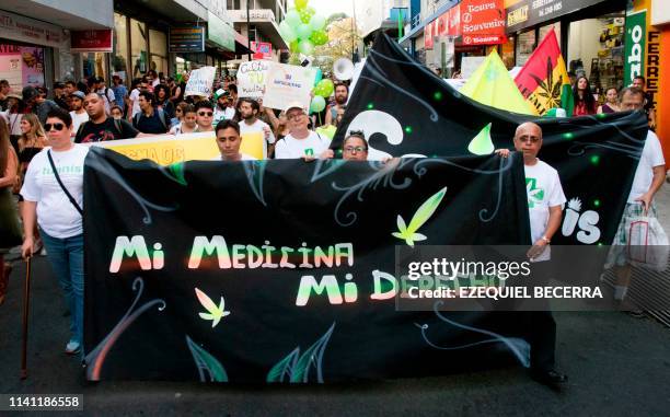 Costa Ricans march during a demonstration to demand the legalization of marijuana and its cultivation for medicinal purposes in San Jose, Costa Rica,...