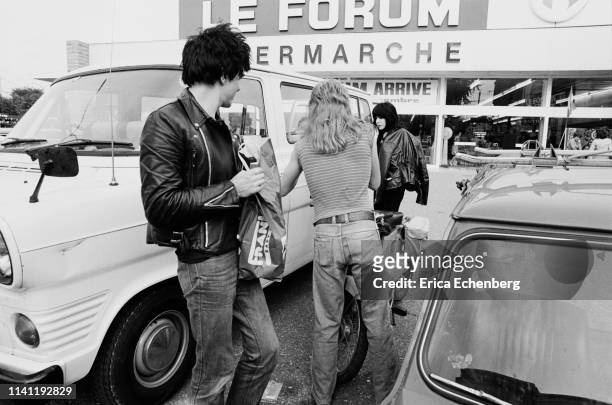 The Damned's tour van parked outside a French supermarket, October 1977. L-R Brian James, the band's tour manager, Laurie Vanian.