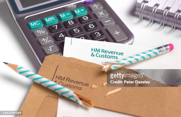 frustration calculating tax demand - hm revenue and customs stockfoto's en -beelden