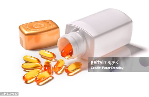 cod liver oil tablets - vitamin a stock pictures, royalty-free photos & images