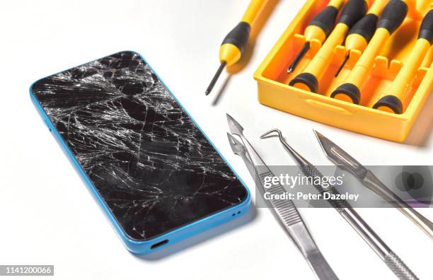 smashed/broken mobile phone repair - cracked iphone stock pictures, royalty-free photos & images