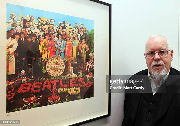 Artist Peter Blake poses for a photograph besides a copy of The Beatles Sgt Pepper LP album cover that he designed in 1967 as he reopens the Holburne...