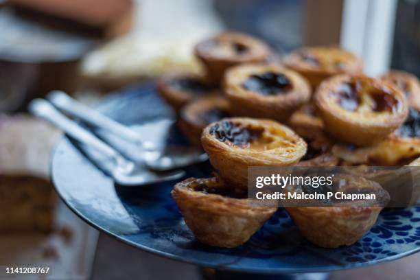 pastel de nata (pastéis de nata or pastel de belém) are also commonly known as portuguese custard tarts - pastel de nata stock pictures, royalty-free photos & images