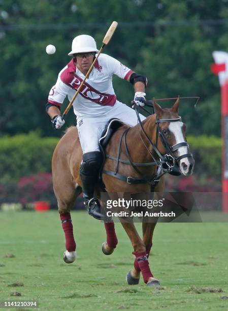Gonzalo Pieres of Pilot plays the ball up field against Postage Stamp during the 2019 Captive One U.S. Open Polo Championship on April 7, 2019 at the...