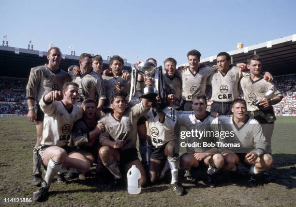 The victorious Widnes rugby league team with the trophy after defeating St Helens in the Rugby League Premiership Final at Old Trafford, Manchester...