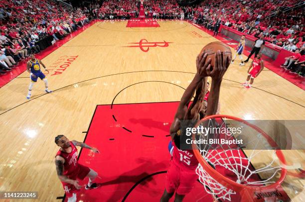 Clint Capela of the Houston Rockets blocks the shot by Andre Iguodala of the Golden State Warriors during Game Three of the Western Conference...