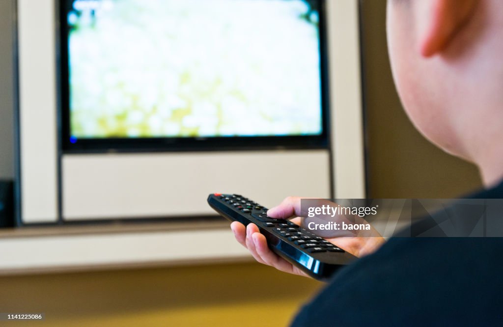 Human Hand Holding The Remote Control High-Res Stock Photo - Getty Images