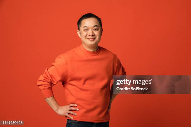 händer på höfter - asian man potrait bildbanksfoton och bilder