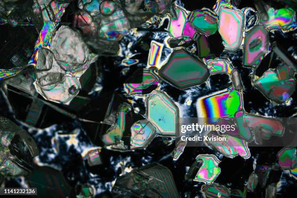 barium chloride under polarized light with black background - polarizer stock pictures, royalty-free photos & images