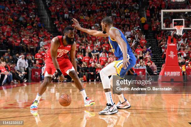 James Harden of the Houston Rockets handles the ball against Kevin Durant of the Golden State Warriors during Game Three of the Western Conference...