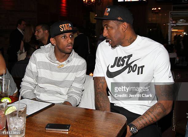 Rapper Fabolous and NBA player Amar'e Stoudemire of the New York Knicks watch Game Five of the Eastern Conference Semifinals between the Boston...