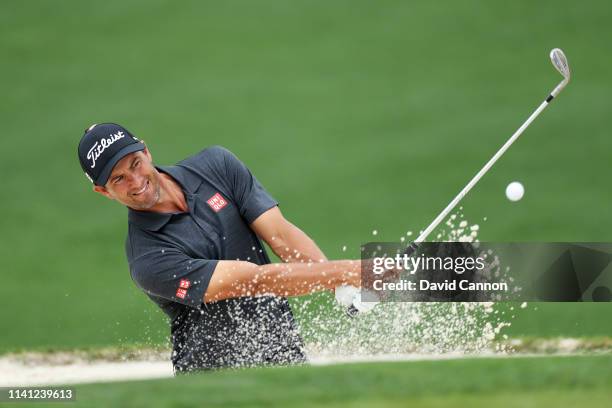 Adam Scott of Australia plays a shot from a bunker during a practice round prior to The Masters at Augusta National Golf Club on April 08, 2019 in...