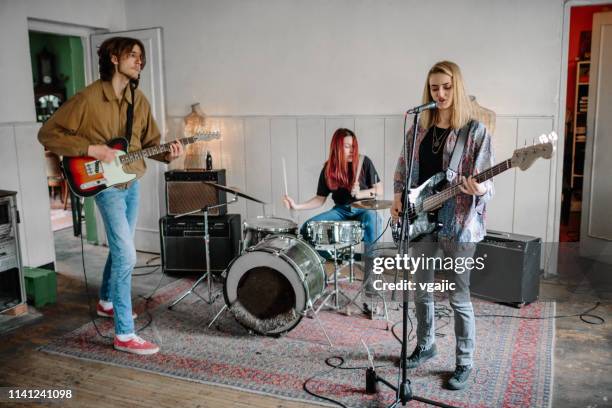 generation z music band on rehearsal - rehearsal stock-fotos und bilder