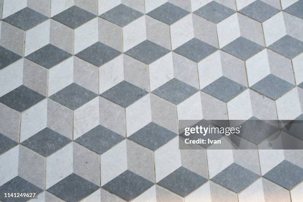 full frame of texture, floor tiles in a gray 3d-effect isometric cube pattern - light blue tiled floor stock pictures, royalty-free photos & images