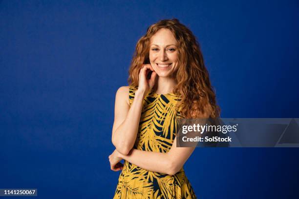 beautiful studio portrait - woman blue background stock pictures, royalty-free photos & images