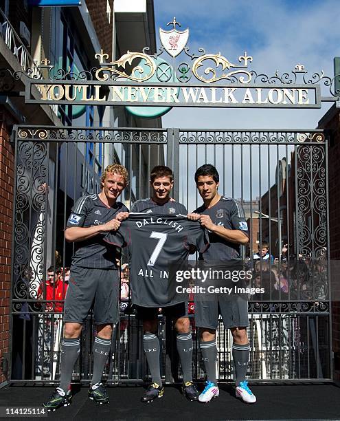 Dirk Kuyt, Steven Gerrard and Luis Suarez of Liverpool FC launch the new Liverpool away kit in front of the Shankly Gates as adidas bring iconic...
