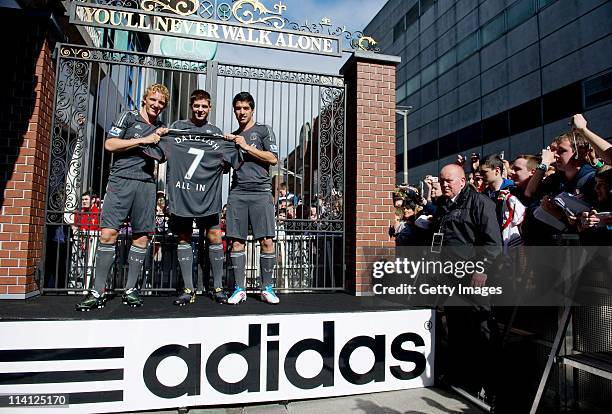 Dirk Kuyt, Steven Gerrard and Luis Suarez of Liverpool FC launch the new Liverpool away kit in front of the Shankly Gates as adidas bring iconic...