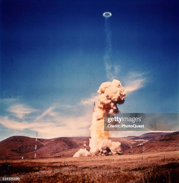 View of the cloud plume and smoke halo from the first test launch of a Minuteman II intercontinental ballistic missile at Vandenberg Air Force Base,...