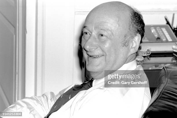Portrait of American politician New York City Mayor Ed Koch as he smiles, seated in a chair in New York City Hall, New York, New York, January 23,...