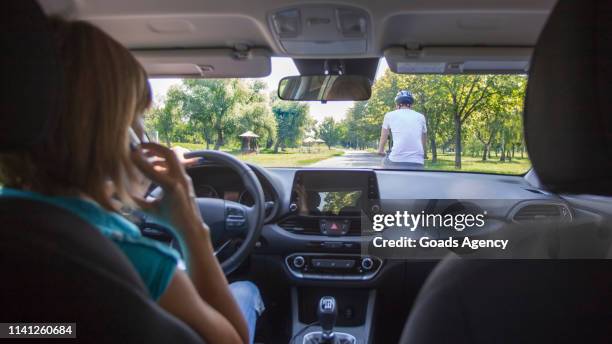 dangerous situation - distracted driving stock pictures, royalty-free photos & images