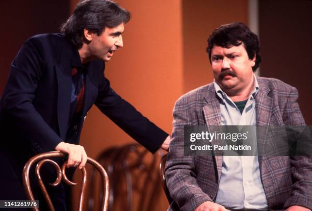 Canadian comedian David Steinberg and American comedian Mike Hagerty perform onstage during the Second City 25th Anniversary performance at the Vic...