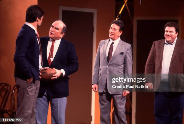 View of American actors, from left, Fred Willard, Ed Asner, Shelley Berman , and George Wendt as they perform onstage during the Second City 25th...