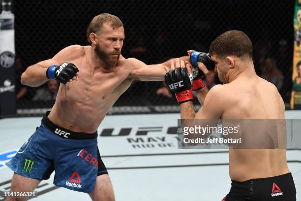 Donald Cerrone punches Al Iaquinta in their lightweight bout during the UFC Fight Night event at Canadian Tire Centre on May 4, 2019 in Ottawa,...