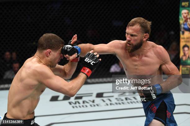 Donald Cerrone punches Al Iaquinta in their lightweight bout during the UFC Fight Night event at Canadian Tire Centre on May 4, 2019 in Ottawa,...