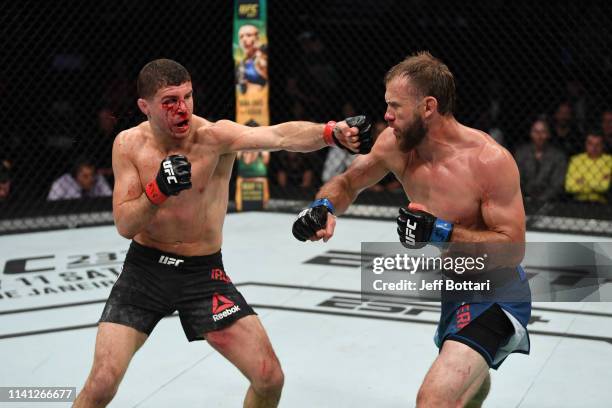 Al Iaquinta punches Donald Cerrone in their lightweight bout during the UFC Fight Night event at Canadian Tire Centre on May 4, 2019 in Ottawa,...