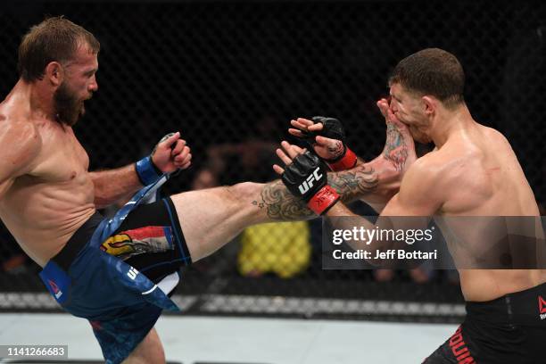 Donald Cerrone kicks Al Iaquinta in their lightweight bout during the UFC Fight Night event at Canadian Tire Centre on May 4, 2019 in Ottawa,...