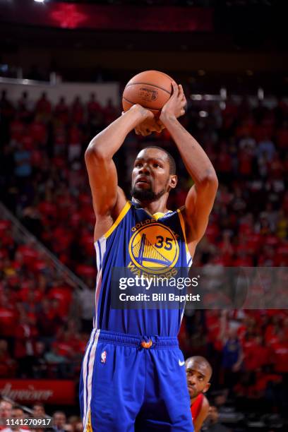 Kevin Durant of the Golden State Warriors shoots a free throw during the game against the Houston Rockets during Game Three of the Western Conference...