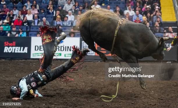 Riley Gagnon of Canada rides Night Shift during the PBR Monster Energy Tour Professional Bull Riders event at Videotron Centre on May 4, 2019 in...