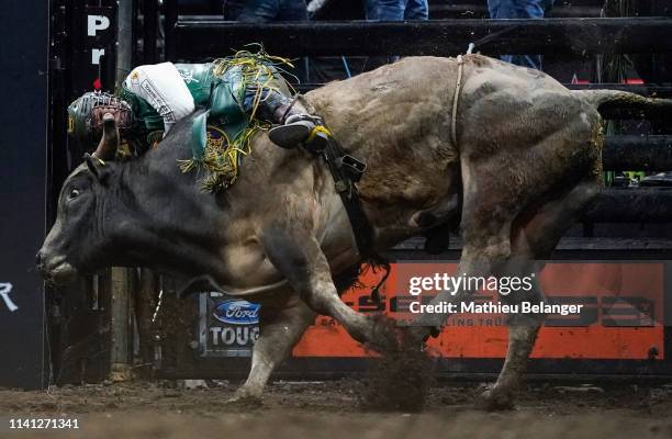 Keyshawn Whitehorse of the USA rides Rehab during the PBR Monster Energy Tour Professional Bull Riders event at Videotron Centre on May 4, 2019 in...