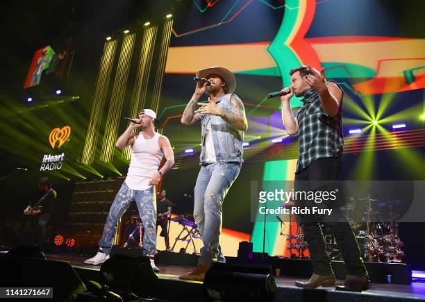 Tyler Hubbard and Brian Kelley of Florida Georgia Line and Morgan Wallen perform onstage during the 2019 iHeartCountry Festival Presented by Capital...