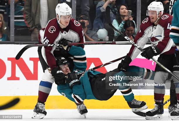 Nikita Zadorov of the Colorado Avalanche gets called for a roughing penalty for pulling Marcus Sorensen of the San Jose Sharks the ice during the...