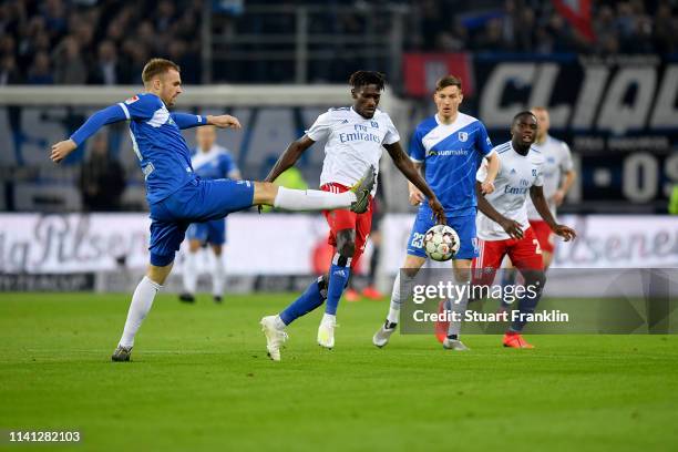 Jan Kirchoff of Magdeburg battles for the ball with Bakery Jatta of Hamburg during the Second Bundesliga match between Hamburger SV and 1. FC...