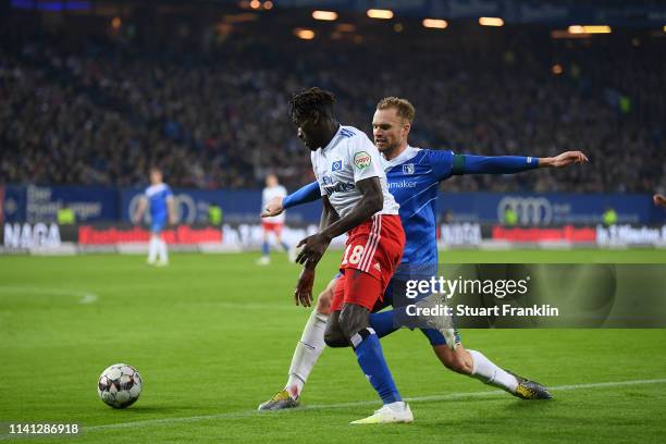 Jan Kirchoff of Magdeburg battles for the ball with Bakery Jatta of Hamburg during the Second Bundesliga match between Hamburger SV and 1. FC...