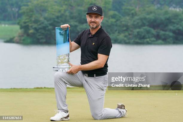 Mikko Korhonen of Finland holds the trophy celebrates after winning the 2019 Volvo China Open at Genzon Golf Club on May 5, 2019 in Shenzhen, China.