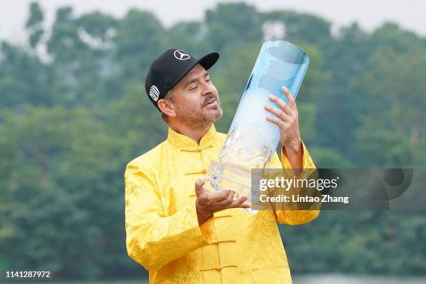 Mikko Korhonen of Finland holds the trophy celebrates after winning the 2019 Volvo China Open at Genzon Golf Club on May 5, 2019 in Shenzhen, China.