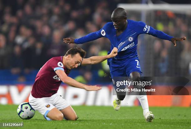 Mark Noble of West Ham United battles with N'golo Kante of Chelsea during the Premier League match between Chelsea FC and West Ham United at Stamford...