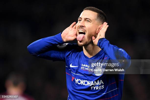 Eden Hazard of Chelsea celebrates after scoring his team's first goal during the Premier League match between Chelsea FC and West Ham United at...