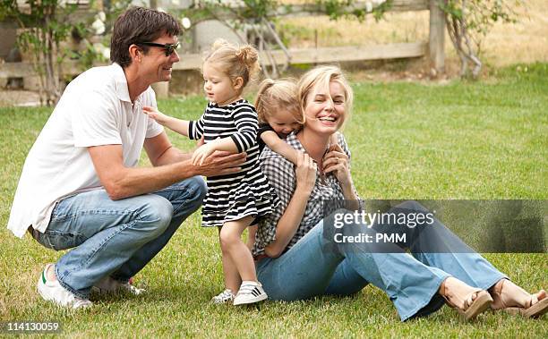 Jerry O'Connell and Rebecca Romijn with their daughters Charlie and Dolly celebrate Mother's Day at a park on May 8, 2011 in Malibu, California.