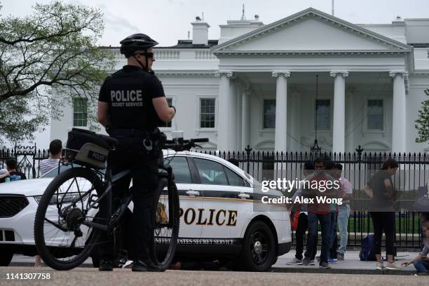 Member of the U.S. Secret Service Uniformed Division stands by his bicycle outside the White House on April 08, 2019 in Washington, DC. Today it was...