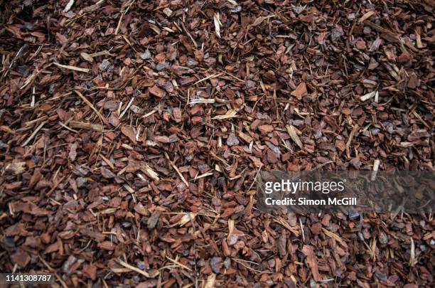 a pile of wood chips to be used as landscaping mulch - shavings stock pictures, royalty-free photos & images