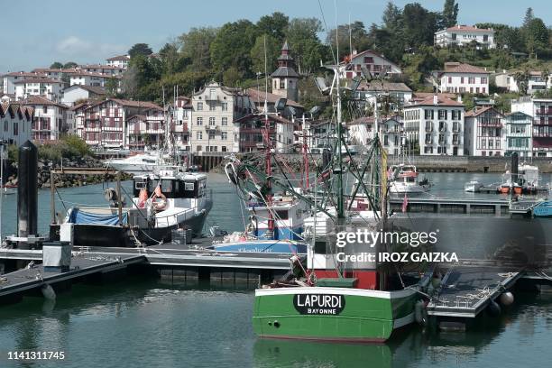 In this photograph taken on April 29 fishing trawlers are moored in the port of Saint-Jean de Luz, on the Bay of Biscay on the French Atlantic coast....