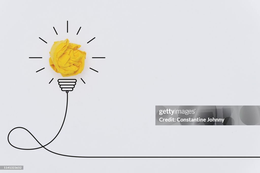 Bulb Concepts with Yellow Crumpled Paper Ball