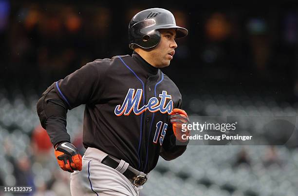Carlos Beltran of the New York Mets rounds the bases on his third home run of the game off of Matt Lindstrom of the Colorado Rockies in the ninth...
