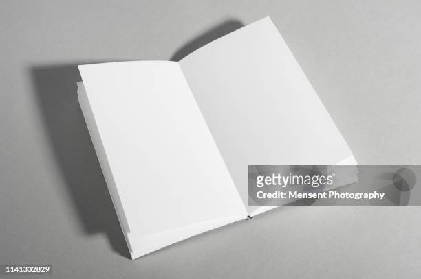 open book with blank pages on gray background - mockup magazine fotografías e imágenes de stock